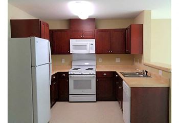 Kitchen with brown cabinets